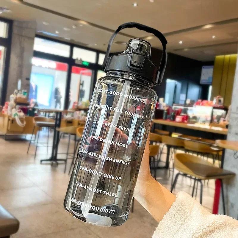 Stay Hydrated with Large Portable Travel Bottles Featuring Motivational Marks
