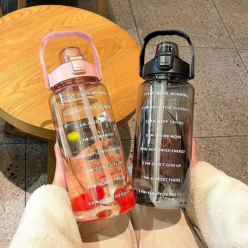 Stay Hydrated with Large Portable Travel Bottles Featuring Motivational Marks