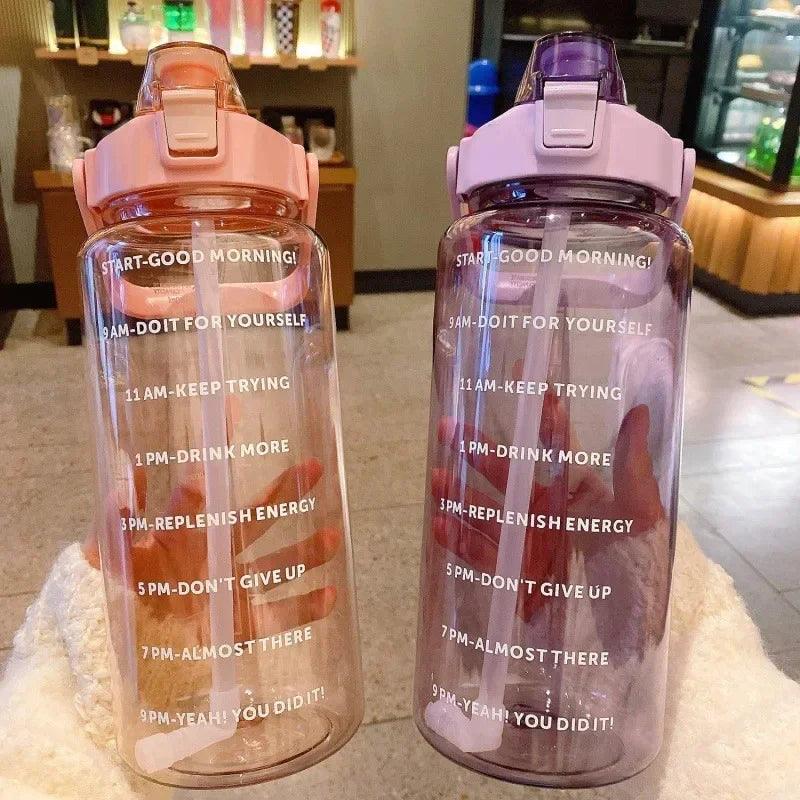 Stay Hydrated with Large Portable Travel Bottles Featuring Motivational Marks